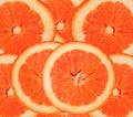 Orange red roud slices cut for background Royalty Free Stock Photo