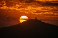 Orange-red sky, sunset and silhouettes of mountains. Royalty Free Stock Photo