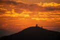 Orange-red sky, sunset and silhouettes of mountains. Royalty Free Stock Photo