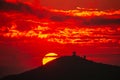 Orange-red sky, sunset and silhouettes of mountains. Royalty Free Stock Photo