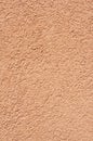 Orange relief plaster on wall closeup Royalty Free Stock Photo