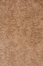 Orange relief plaster on wall closeup Royalty Free Stock Photo