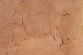 Orange relief plaster on wall closeup Royalty Free Stock Photo