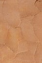 Orange relief plaster on wall closeup Royalty Free Stock Photo