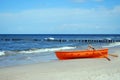 Orange rescue boat on a beach Royalty Free Stock Photo