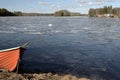 Orange rescue boat on the shore of a frozen lake