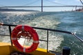 Orange rescue ring on a ferry boat in Lisbon