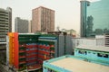 Orange building between office buildings in downtown of Bangkok city Royalty Free Stock Photo