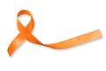 Orange ribbon for leukemia, kidney cancer, multiple sclerosis RSD awareness isolated on white background; Satin fabric color Royalty Free Stock Photo