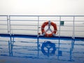 Orange ring lifebuoy on ferry boat deck