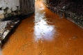 Orange river of sulphide fumaroles in the town of Furnas on the island of San Miguel.