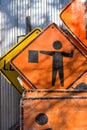 Orange Road Construction Signs with Flagman Caution Royalty Free Stock Photo