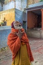 Orange-robed Sadhu Indian Monk Holy man inside Vintage Mataji or Devi