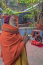 Orange-robed Sadhu Indian Monk Holy man inside Vintage Mataji