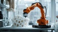 Orange Robotic Arm Precisely 3D Printing a Complex White Porous Structure