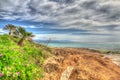Orange rocks in Le Bombarde beach in hdr Royalty Free Stock Photo