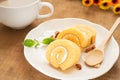 Orange roll cake and coffee cup