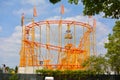 Orange roller coaster ride at funfair as part of `Festival of German-American Friendship in Heidelberg