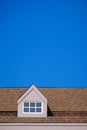 orange roof of the house with white window frame Royalty Free Stock Photo