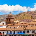 Orange roofs of peruvian houses with fountain of Incan emperor Pachacuti and Basilica De La Merced at Plaza De Armas, Cuzco, Peru Royalty Free Stock Photo