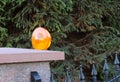 Orange room alarm light located on a brick fence post. Intercom apartment building at the entrance to a private protected area. Ha