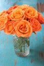 Orange rose flowers in vase