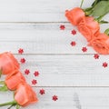 Orange roses decorated with red flower glitter