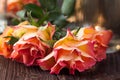 Orange roses on table Royalty Free Stock Photo