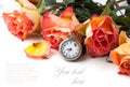 Orange roses with vintage clock Royalty Free Stock Photo