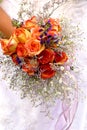 Orange roses wedding bouquet