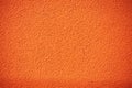 Orange rough plaster wall, rugged texture or background
