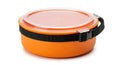 Orange round food container with black strap and clear lid Royalty Free Stock Photo