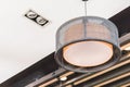 Orange round stylish lampshades hang from ceiling Royalty Free Stock Photo