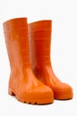 Orange rubber boots isolated