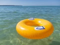 Orange rubber ring in the sea