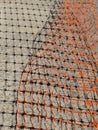 Orange Safety Barrier Mesh and Grid Shadow on Concrete Royalty Free Stock Photo