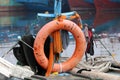 Orange safety life ring hanging on fishing boat masts Royalty Free Stock Photo