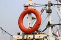 Safety life ring hanging on fishing boat masts Royalty Free Stock Photo