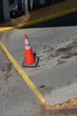 Orange safter cone blocking cars from entering wrong lane