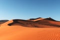 Orange sand dunes and clear sky in Namib desert Royalty Free Stock Photo