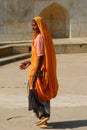 In an orange sari