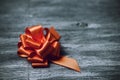 Orange satin gift ribbon bow