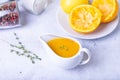 Orange sauce for duck poultry in a white gravy boat. Royalty Free Stock Photo