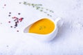 Orange sauce for duck poultry in a white gravy boat. Royalty Free Stock Photo