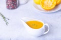 Orange sauce for duck poultry in a white gravy boat. Royalty Free Stock Photo