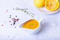 Orange sauce for duck poultry in a white gravy boat. Royalty Free Stock Photo