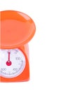 Orange scales weighing products on white background kitchen equipment object isolated Royalty Free Stock Photo