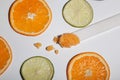 Orange scrub on a spatula between orange and lime pieces. Royalty Free Stock Photo