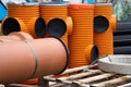 Orange Sewer pipes with fittings and black cap . Different sewer pipes systems Royalty Free Stock Photo