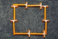 Orange shaving razors frame at gray background